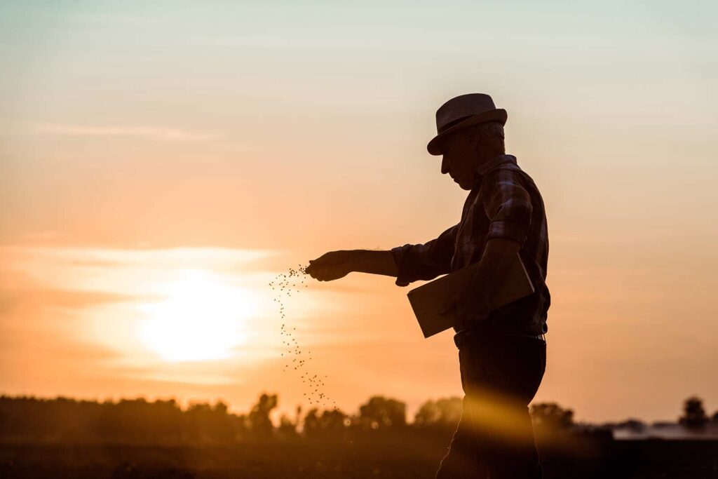 farmer sowing seeds all native crp mix